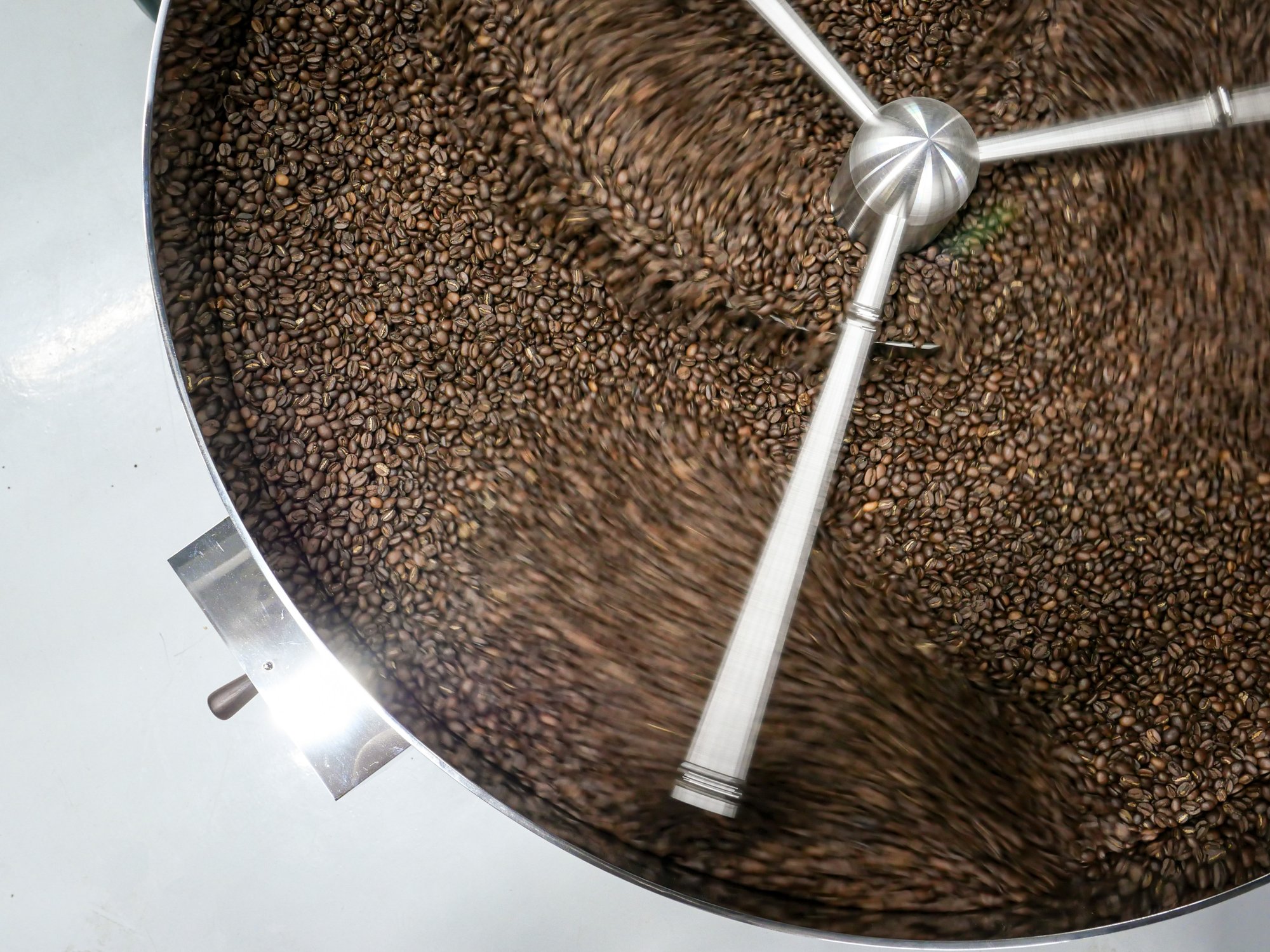 Coffee beans roasting inside the drum